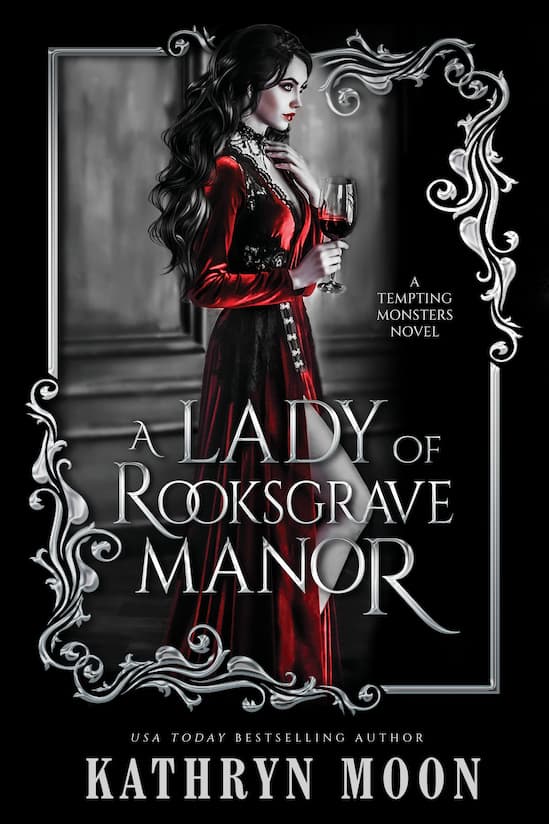 Book cover for 'A Lady of Rooksgrave Manor' by Kathryn Moon, featuring a woman in a long red dress holding a wine glass against a dark gothic interior, framed by ornate silver scrollwork on a black background.