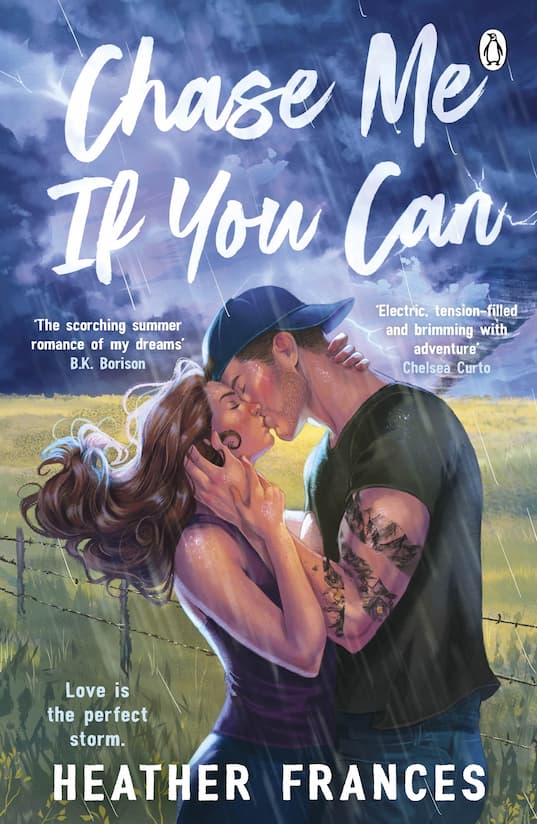 The Book Cover of 'Chase Me if You Can' by Heather Frances, featuring a male/female couple embracing in a kiss in front of a stormy field. He is wearing a backwards cap and has tattoos down his left arm. 