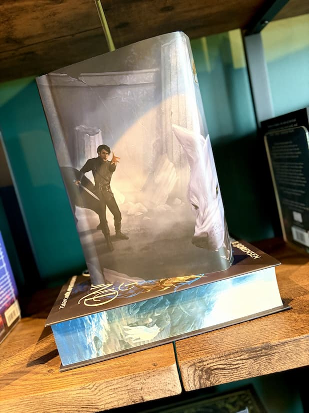 Book cover of 'Fury Bound' by Sable Sorensen featuring a white rundown temple, the face of a white wolf, and a white man with black hair and black outfit.