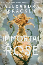Book cover of 'Immortal Rose' by Alexandra Bracken with a light blue background with white flowers and green thorns on either side of a gold perfume bottle with a gilded rose topper.