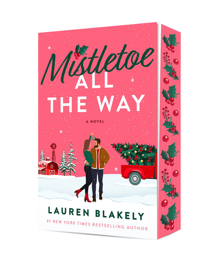 Book cover for Mistletoe All the Way by Lauren Blakely, featuring an illustrated couple cuddling under mistletoe in the middle of a snowy small town Christmas scene, with pink sprayed edges with holly leaves and berries.