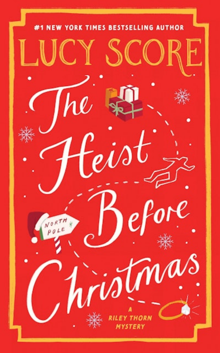 Book cover for 'The Heist Before Christmas' by Lucy Score, featuring a festive red background with white script lettering, gold decorative border and title text, small gift and snowflake illustrations, and a small figure running along a curved path.